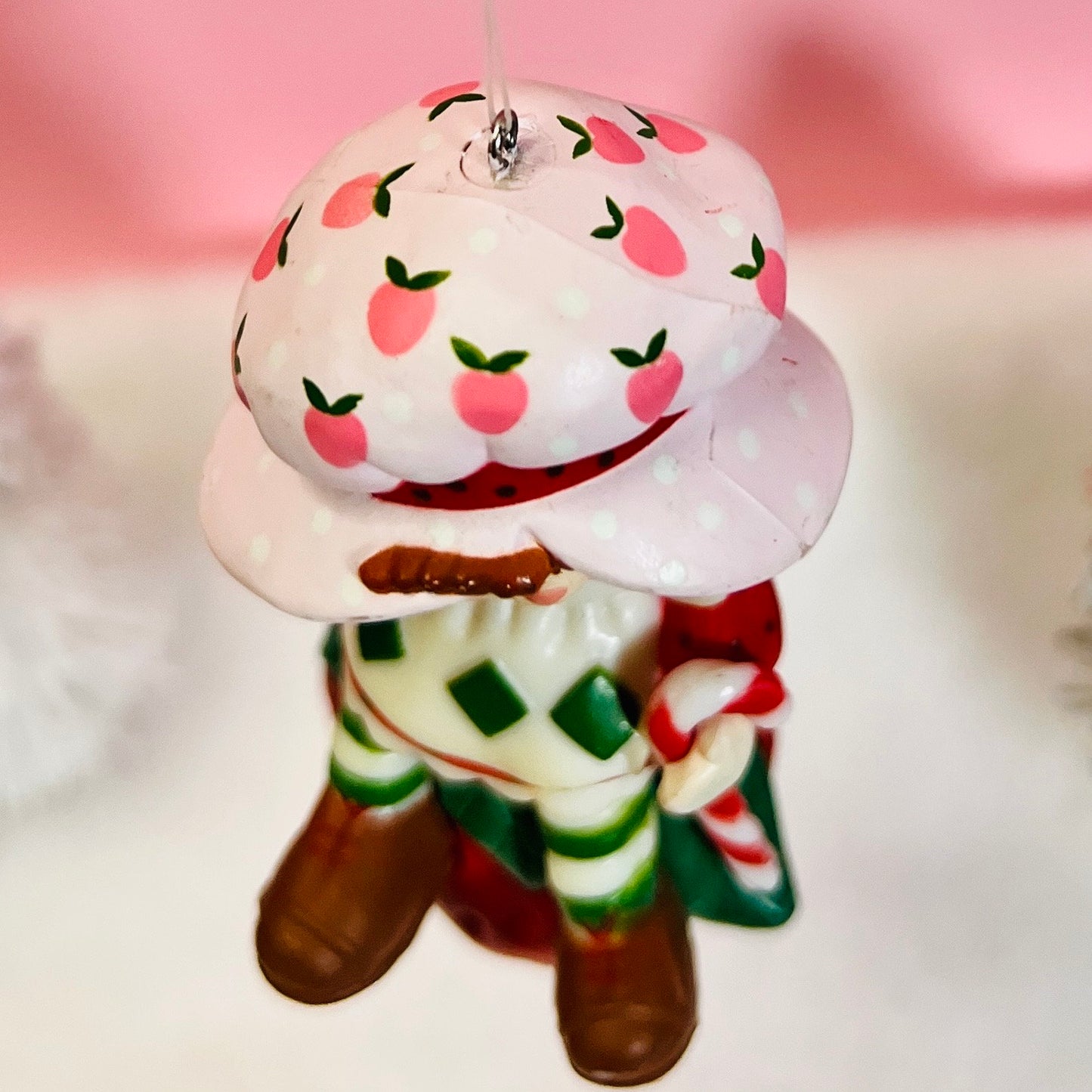 Boxed 1982 Vintage Strawberry Shortcake Ceramic Christmas Ornament: Strawberry Herself with Candy Cane sitting on a Strawberry! - Dolly Magic