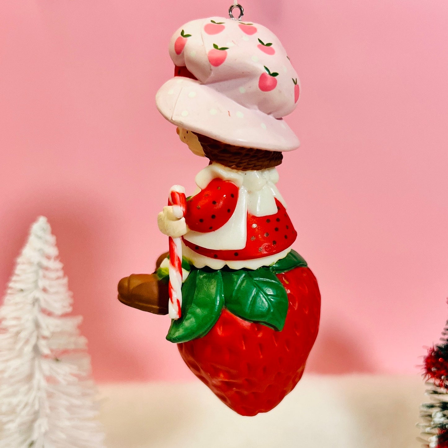 Boxed 1982 Vintage Strawberry Shortcake Ceramic Christmas Ornament: Strawberry Herself with Candy Cane sitting on a Strawberry! - Dolly Magic