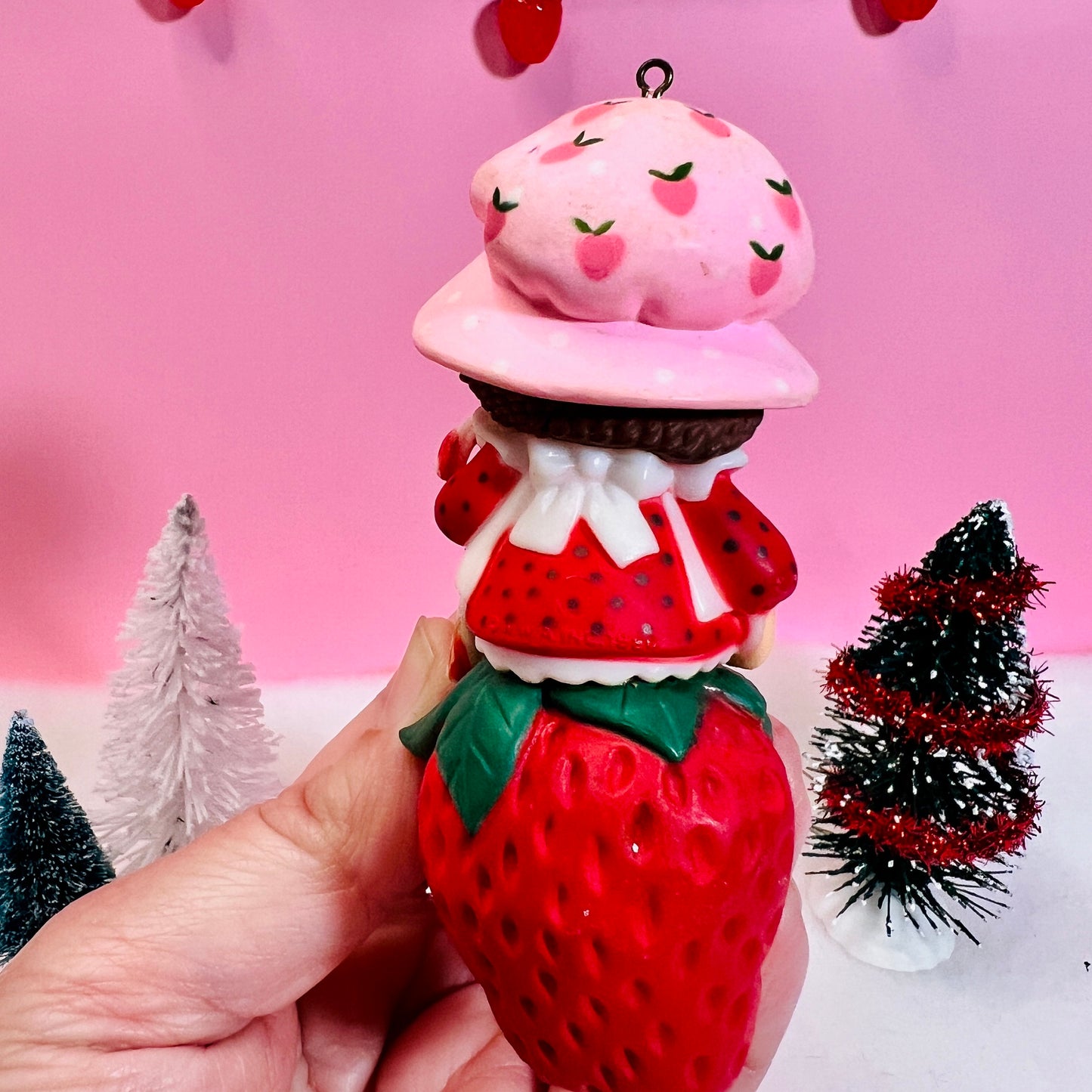 1982 Vintage Strawberry Shortcake Ceramic Christmas Ornament: Strawberry Herself with Candy Cane sitting on a Strawberry! - Dolly Magic