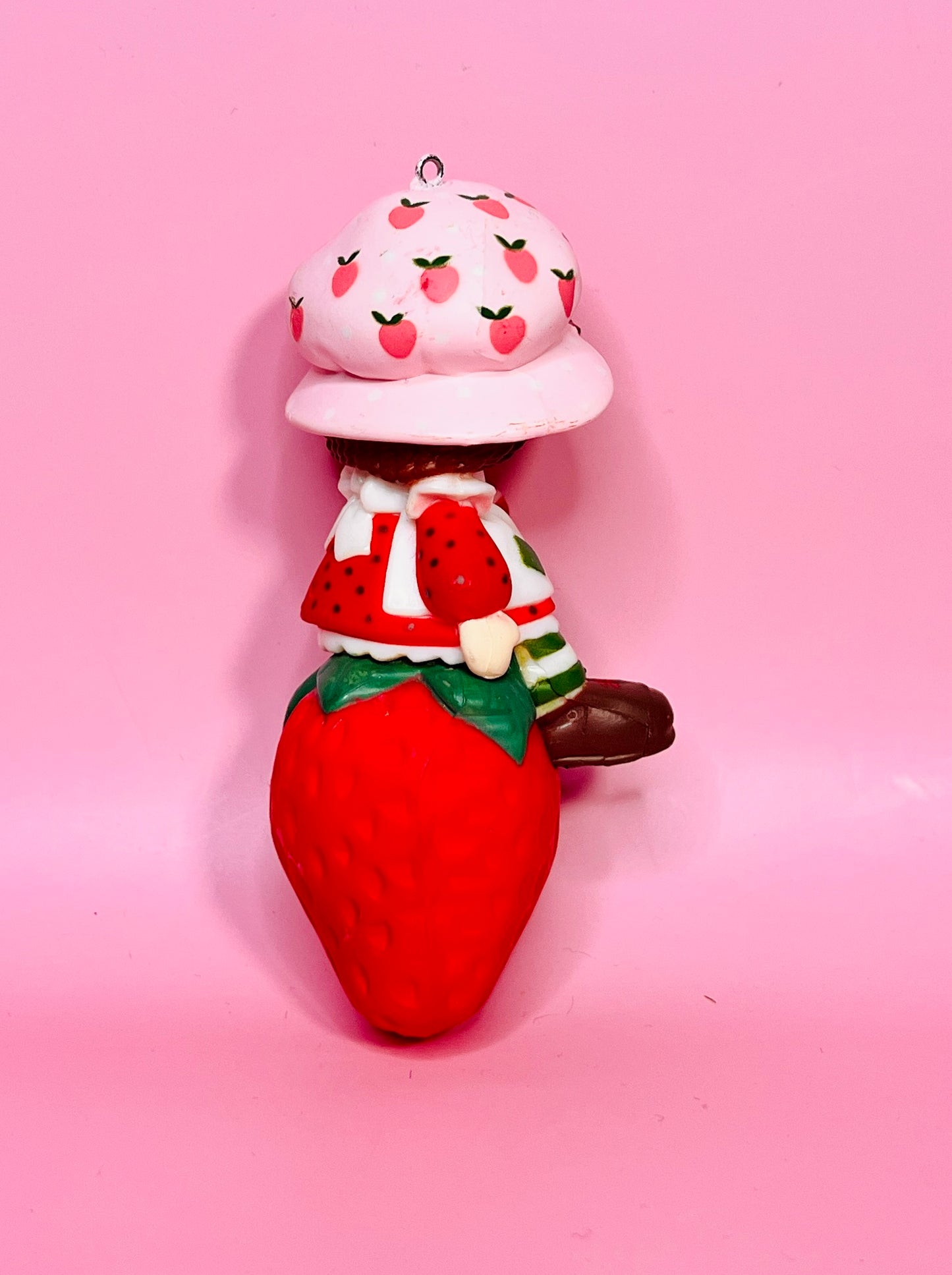 1982 Vintage Strawberry Shortcake Ceramic Christmas Ornament: Strawberry Herself with Candy Cane sitting on a Strawberry!